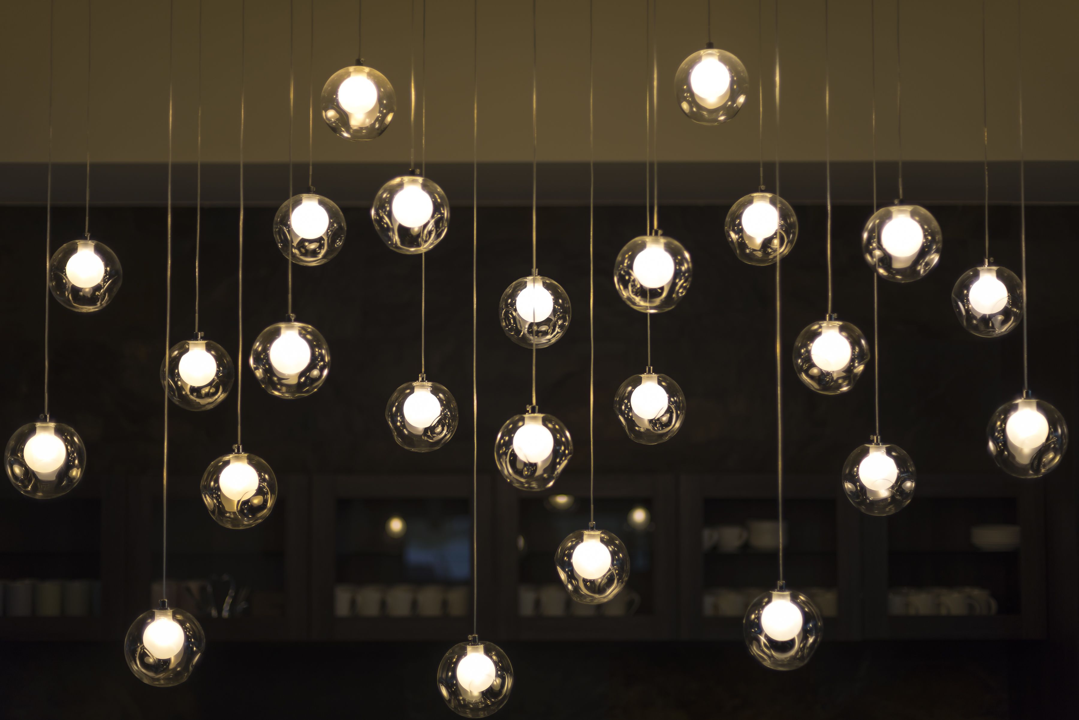 A series of spherical light fixtures suspended from the ceiling.