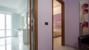 A modern bathroom with a glass shower enclosure, a white sink, and a mirror. - Hotel San Marco (Rionero in Vulture)