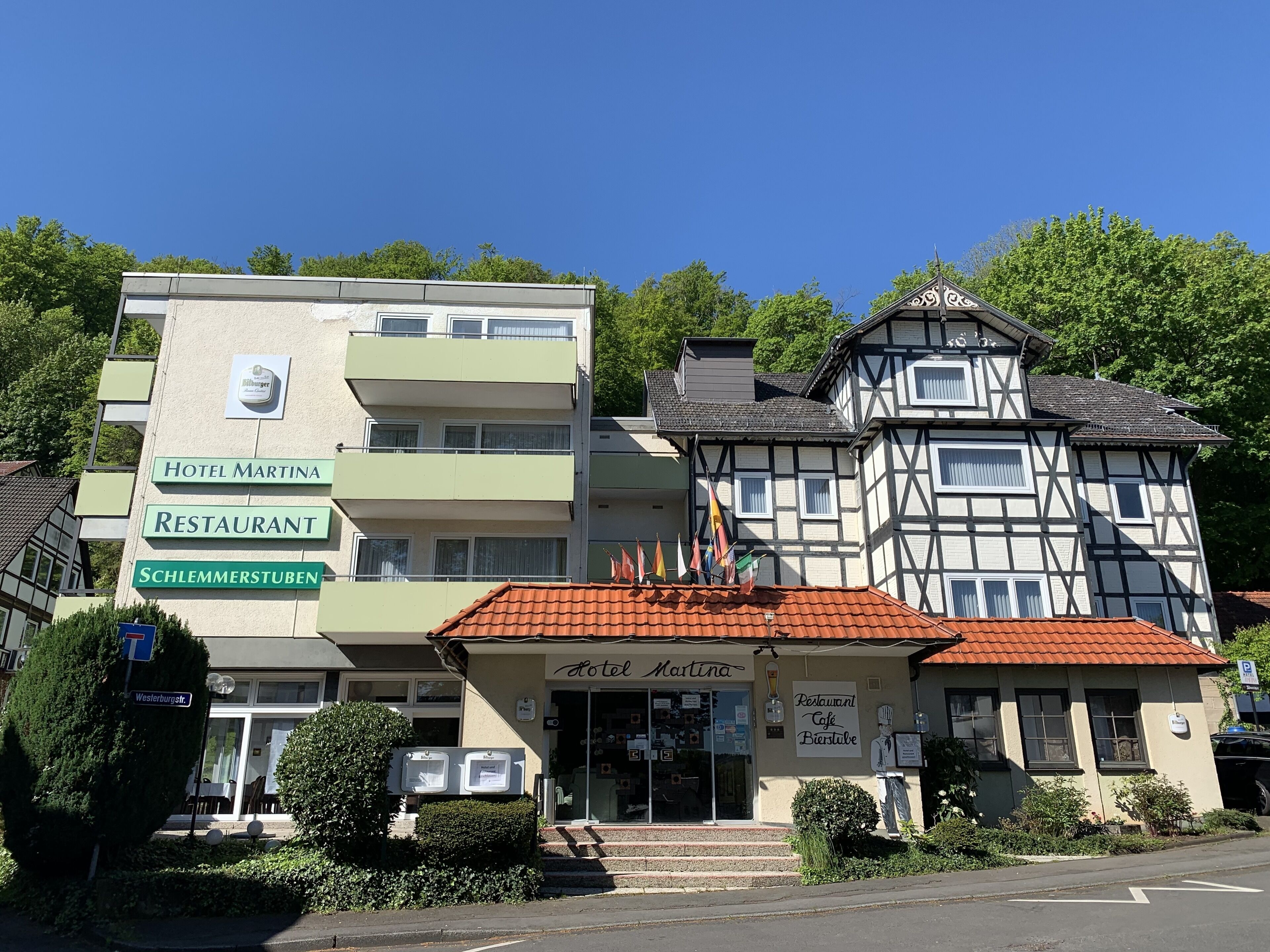 A hotel named 'Hotel Martina' with a restaurant and a bar on the ground floor.