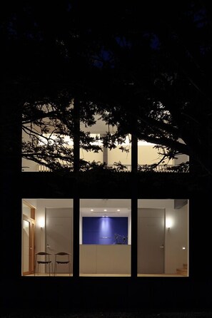 A building with three visible rooms, each with a door and a window. - Wakkanupuri (Teshikaga)