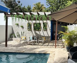 Outdoor pool, open 9:00 AM to 10:00 PM, pool umbrellas