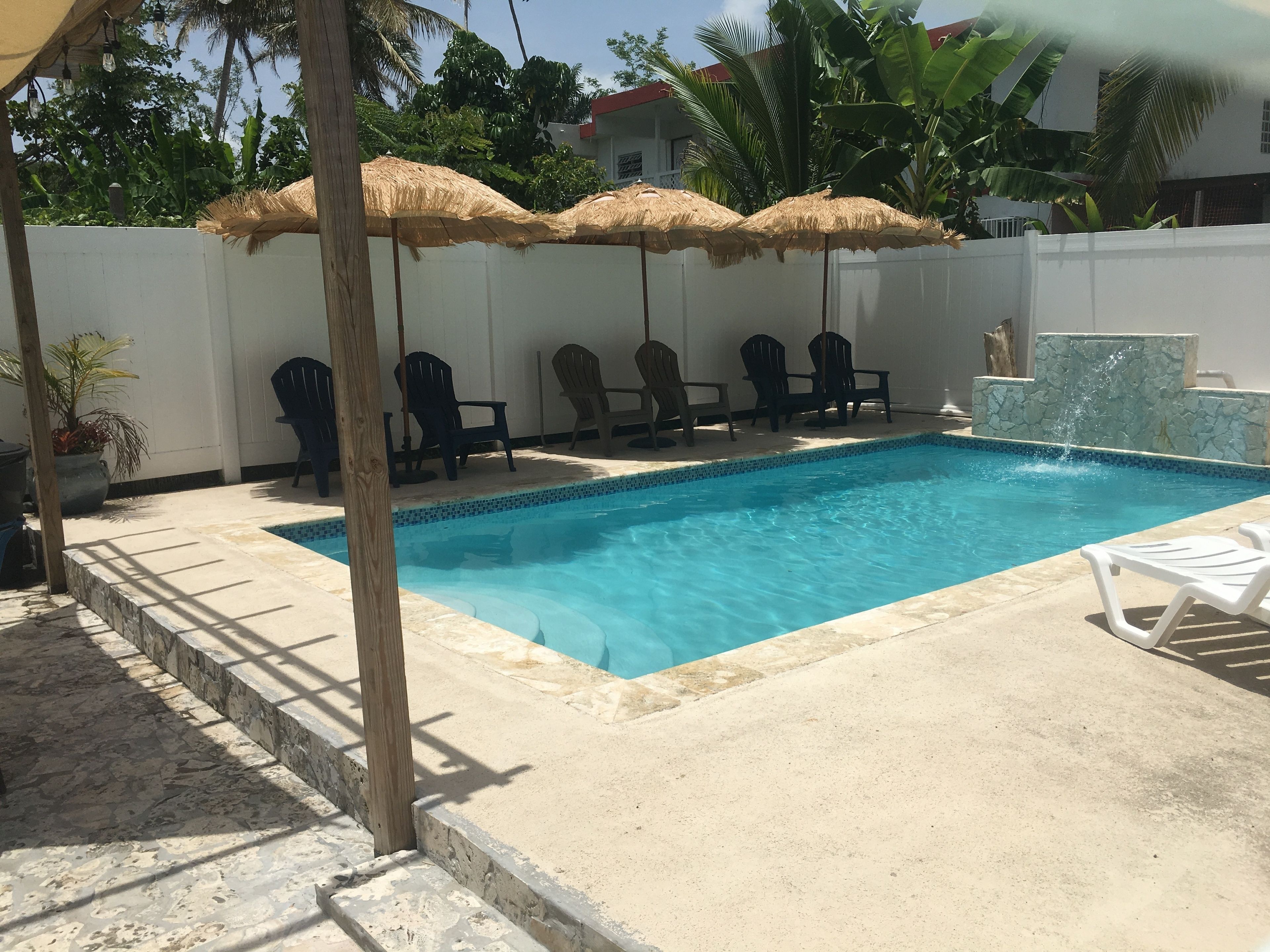 Outdoor pool, open 9:00 AM to 10:00 PM, pool umbrellas