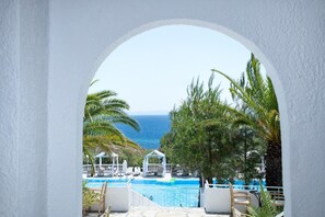 Seasonal outdoor pool, pool umbrellas, pool loungers