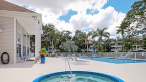 A pool area with lounge chairs and a covered seating area. - Location! Location! Location!  Sarasota!!! (Sarasota)