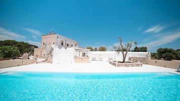 Indoor pool, outdoor pool, pool umbrellas, pool loungers