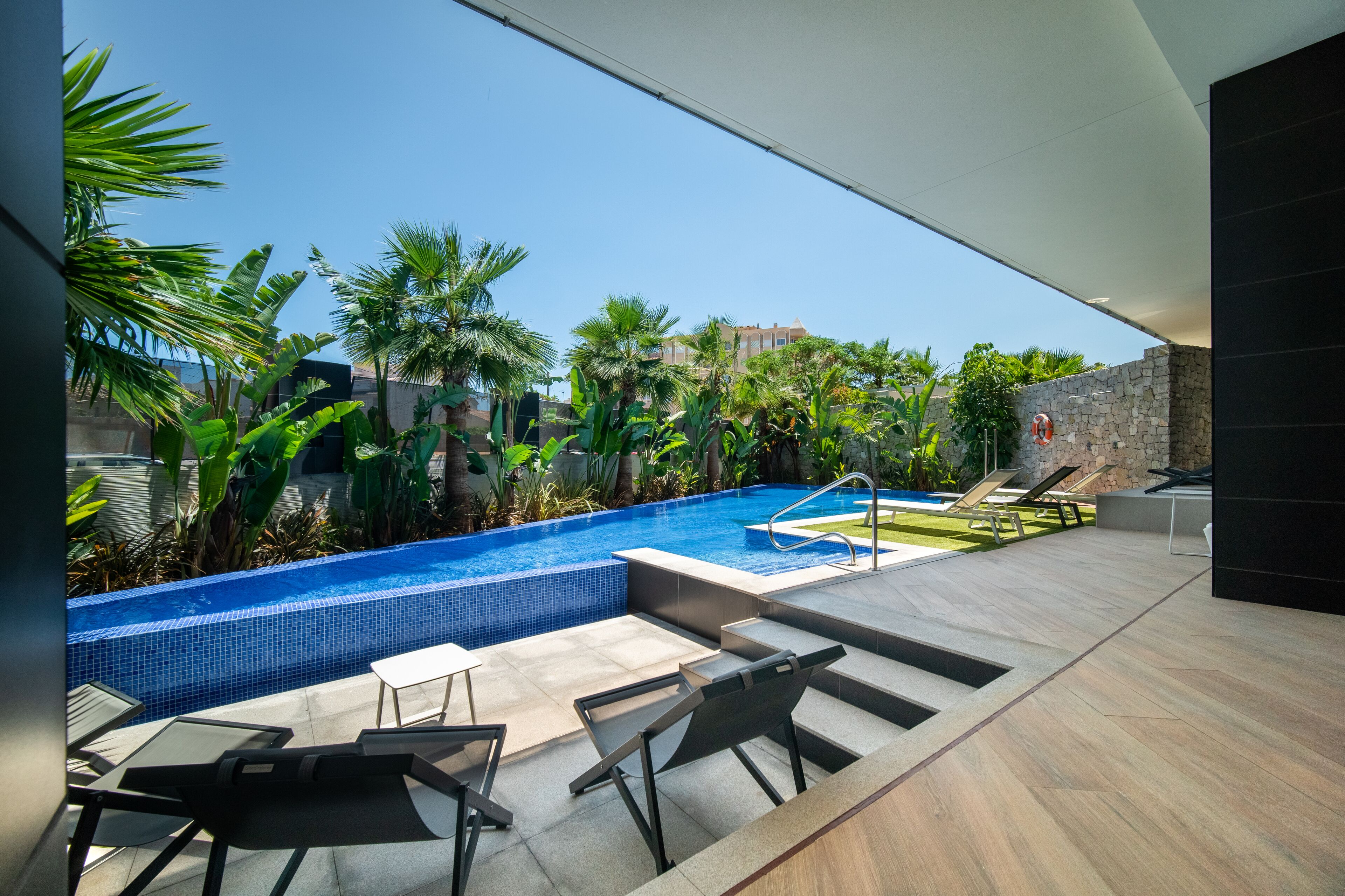 Seasonal outdoor pool, open 9:00 AM to 8:30 PM, pool loungers