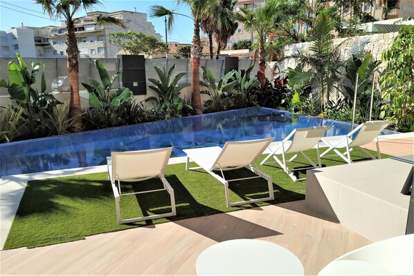 Seasonal outdoor pool, open 9:00 AM to 8:30 PM, sun loungers