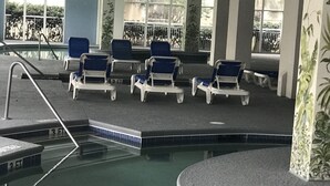 A pool area with lounge chairs and a poolside seating area. - THANK YOU 2025 RENTERS for 100%. 2026 only 3 weeks left DIRECT OCEAN FRONT 5BR  (Myrtle Beach)