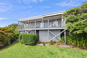 A two-story house with a balcony, a staircase, and a well-maintained garden. - Anglesea Outlook (Anglesea)