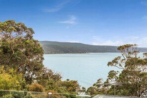 A coastal landscape with a view of the sea and distant hills. - Scelta Ask About Specials Wifi And Location (Lorne)