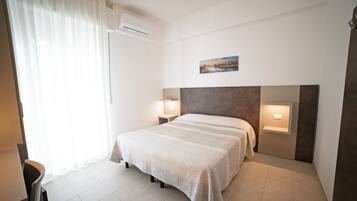 Deluxe Double or Twin Room | Minibar, in-room safe, desk, travel cot