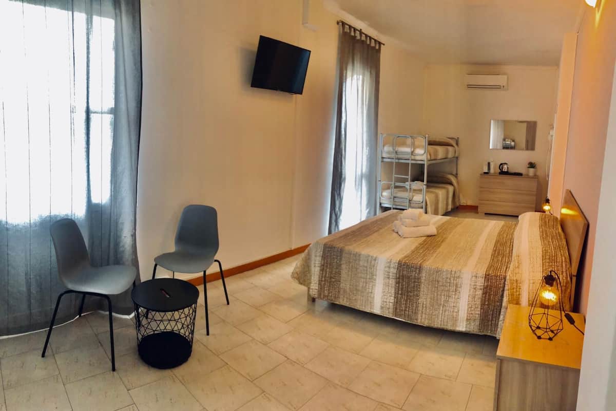 Superior Quadruple Room | Minibar, in-room safe, desk, travel crib
