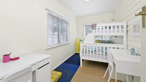 A child's room with a bunk bed, a desk, and a window with blinds. - Sur La Mer (Lorne)