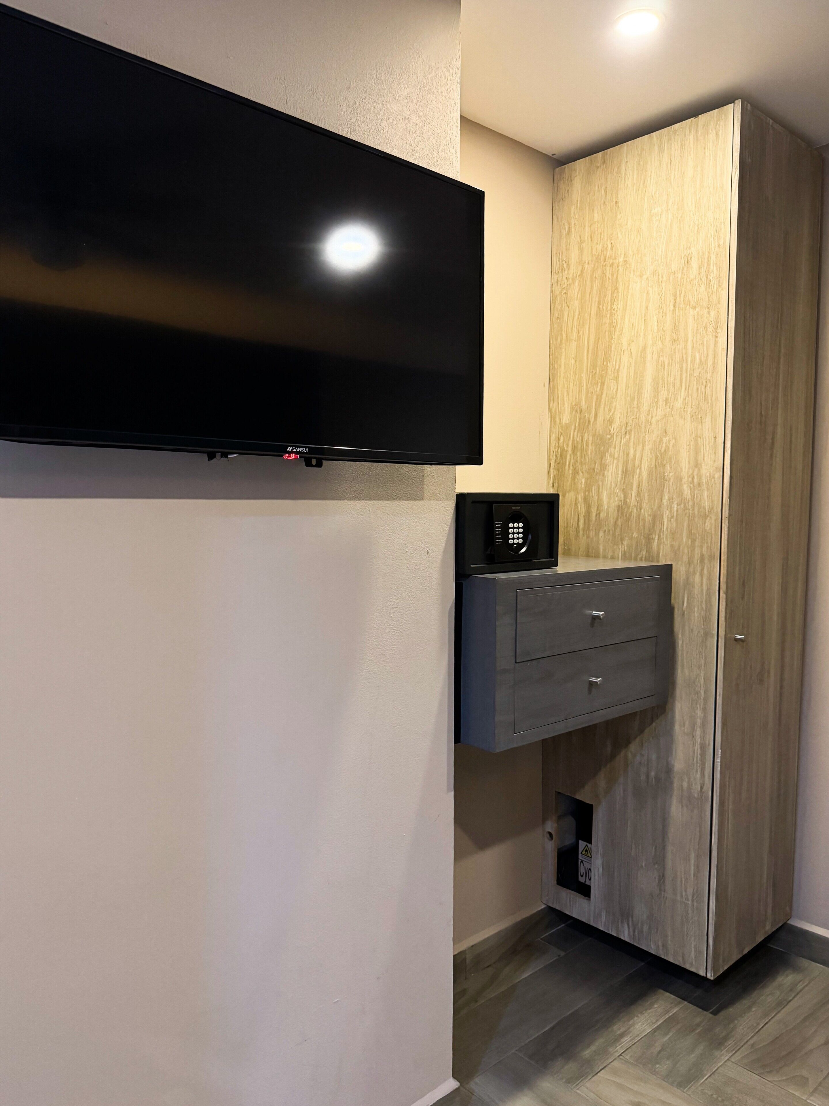 deluxe quadruple room | minibar, in-room safe, desk, laptop workspace