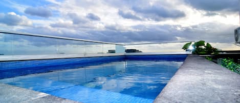 Outdoor pool, open 8:00 AM to 10:00 PM, pool loungers