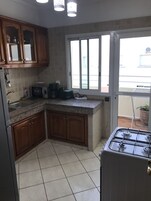 Apartment (Chambre Appartement) | Private kitchen | Full-size fridge, microwave, oven, stovetop
