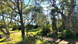 A park with mature trees and a walking path. - On Collingwood Beach  by Book Jervis Bay - Upstairs Apartment (Vincentia)
