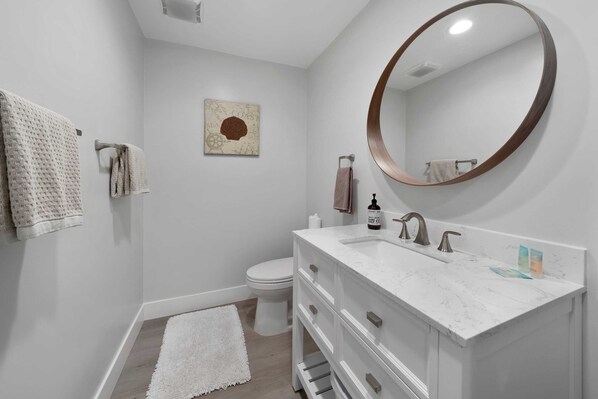 Shower, hair dryer, towels, shampoo
