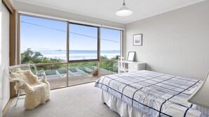 A bedroom with a large window, a bed, a chair, and a desk. - Seamoon - Apollo Bay (Apollo Bay)