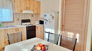 Fridge, microwave, toaster, cookware/dishes/utensils