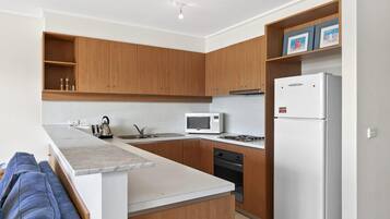 Fridge, toaster, cookware/dishes/utensils