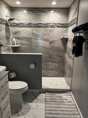 Shower, hair dryer, towels, soap