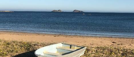 On the beach, sun loungers