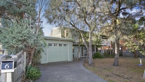 A residential driveway leading to a garage with a mailbox marked '6' on the left. - Apollo Bay People N Paws (Apollo Bay)