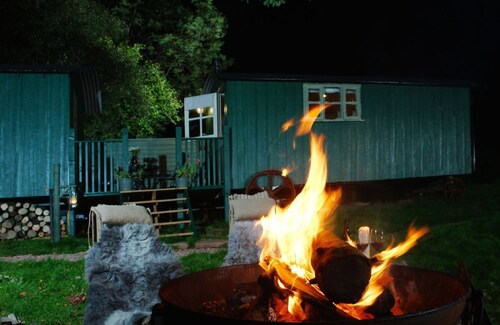 Anne's Hut offers a romantic retreat for two in two interlinked shepherd's huts with decking area an