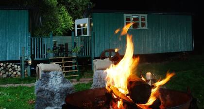 Anne's Hut offers a romantic retreat for two in two interlinked shepherd's huts with decking area an