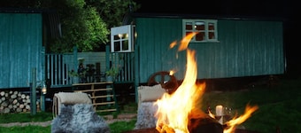 Anne's Hut offers a romantic retreat for two in two interlinked shepherd's huts with decking area an
