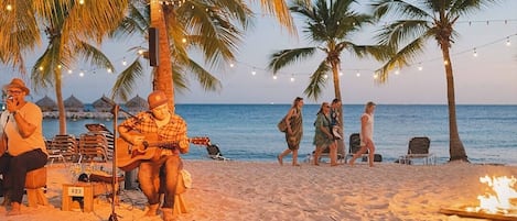 On the beach, sun loungers, beach umbrellas, beach towels