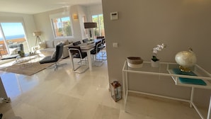 A spacious living area with a dining table, sofas, and a view of the outdoors. - ⭐ DREAM SEA VIEW PENTHOUSE - LUXURIOUS 3 BEDROOMS ⭐ (Calahonda)