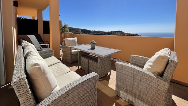 A sunlit outdoor seating area with wicker furniture and a view of the sea. - ⭐ DREAM SEA VIEW PENTHOUSE - LUXURIOUS 3 BEDROOMS ⭐ (Calahonda)