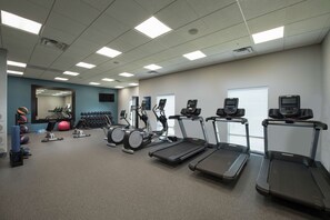 A gym with treadmills, elliptical machines, and free weights. - Hampton Inn & Suites Snellville Atlanta NE (Snellville)