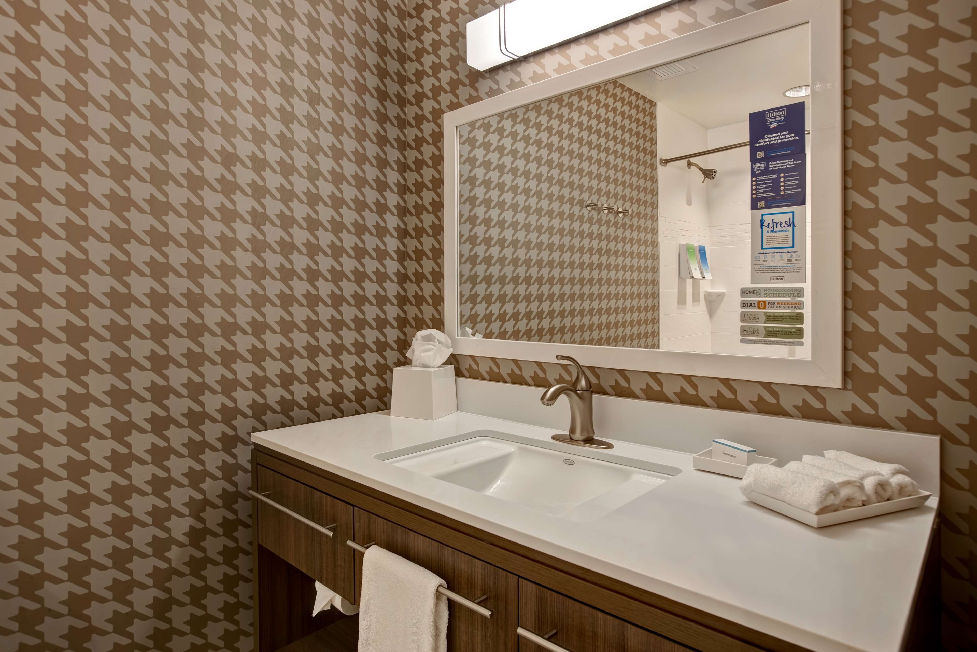 shower, designer toiletries, towels