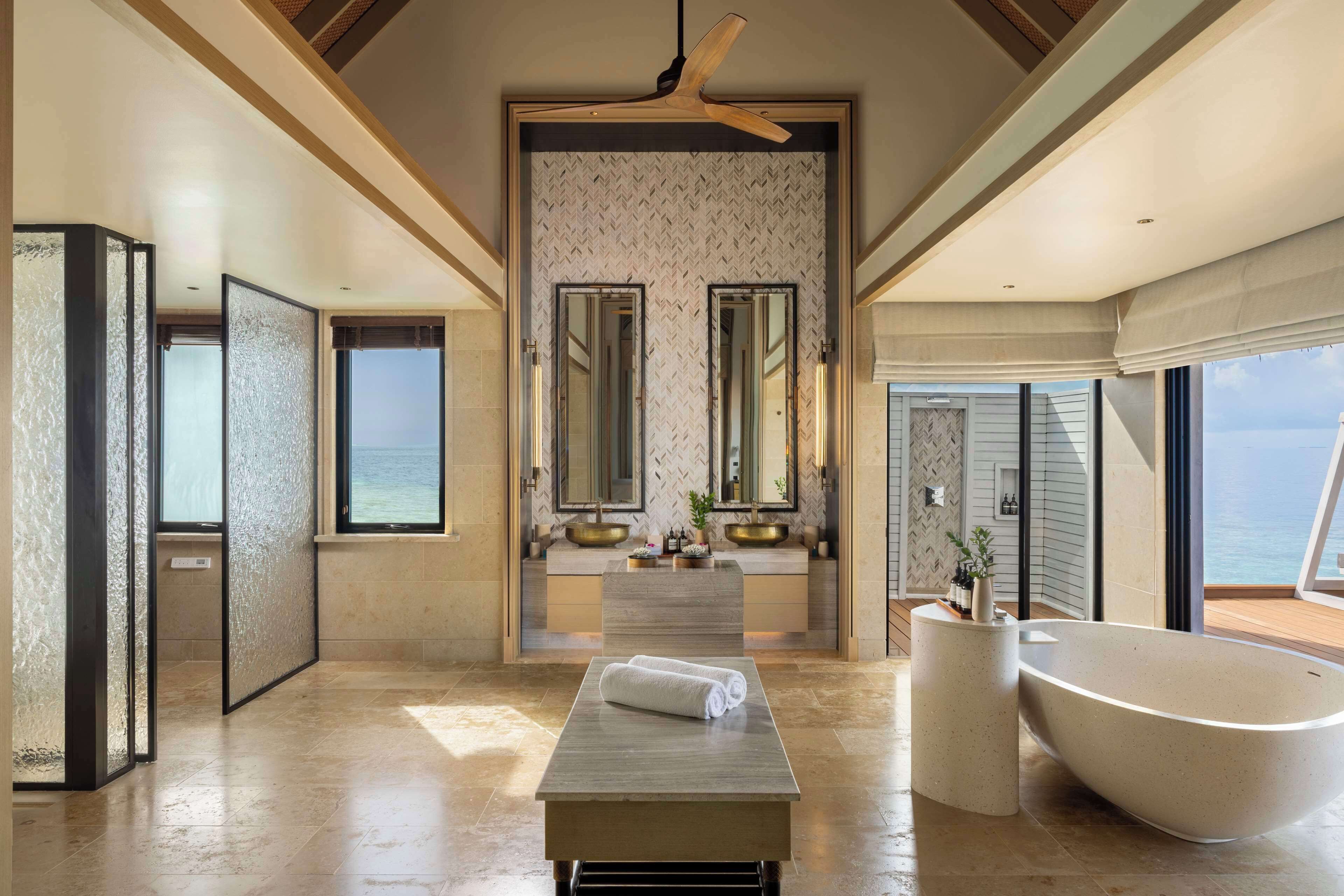 ithaafushi private island | bathroom | separate bathtub and shower, deep-soaking bathtub, free toiletries