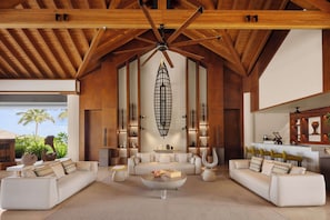 Ithaafushi Private Island | Living area | 65-inch flat-screen TV with cable channels, TV