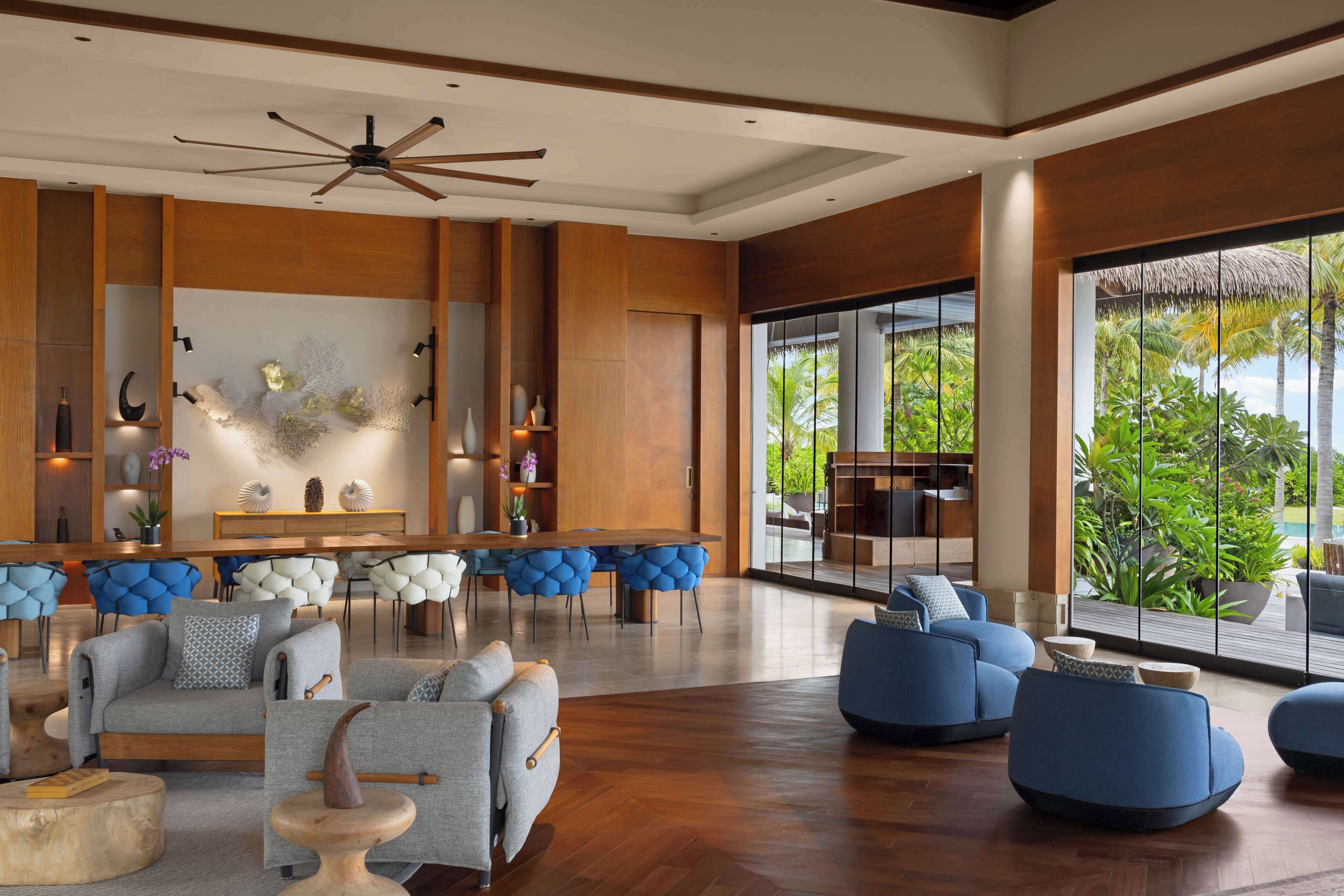 ithaafushi private island | living area | 65-inch flat-screen tv with cable channels, tv