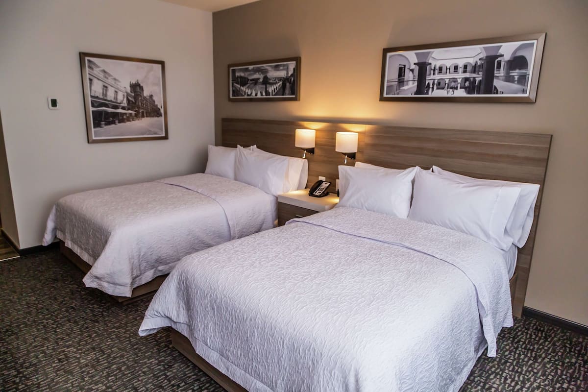 Room, 2 Double Beds, Non Smoking | Premium bedding, minibar, in-room safe, individually decorated