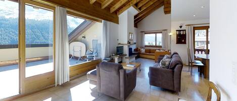 Télévision, cheminée, lecteur de DVD, chaîne hi-fi