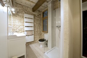 Shower, hair dryer, towels, toilet paper