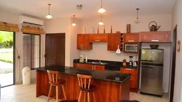 Deluxe Villa, Multiple Beds, Non Smoking, Pool View | Private kitchen | Full-sized fridge, microwave, oven, stovetop