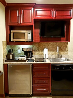 Fridge, microwave, coffee/tea maker, cookware/dishes/utensils