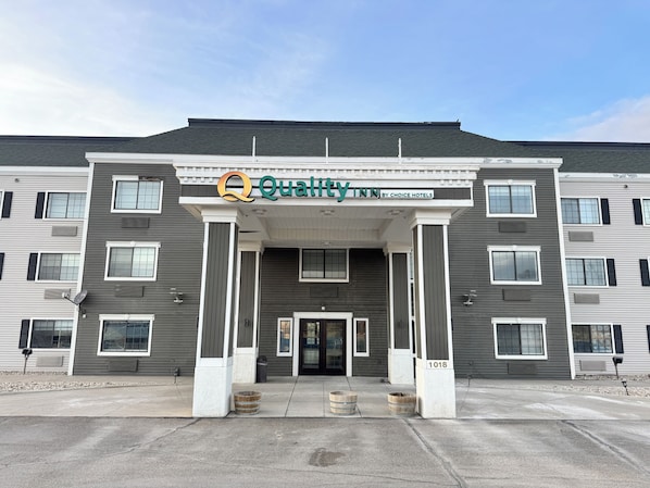 A multi-story hotel with a modern facade, large windows, and a prominent entrance.