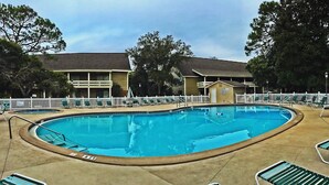 A swimming pool with lounge chairs and a wooden building in the background. - SEASCAPE SUMMER SPECIAL/Golf Course Villa-2BR/LakeView/PET OK/Short Walk toBeach (Miramar Beach)