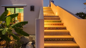 A staircase with decorative tiles leading to a building entrance. - Sweeping ocean views steps to beach w/pool & Firepit. Close to Tres Palapas!  (Los Barriles)