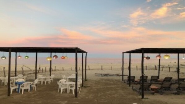 On the beach, sun loungers, beach towels