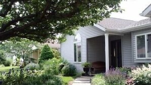 A house with a covered porch, a stone pathway, and various plants. - Home in Mechanicsburg, PA close to  Carlisle, Camp Hill, Enola, Harrisburg area (Mechanicsburg)