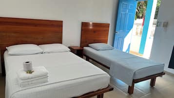 Basic Triple Room, Multiple Beds, Non Smoking, Ocean View | Pillow-top beds, bed sheets